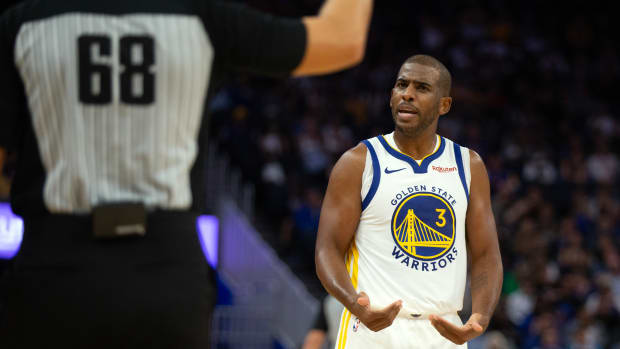 Warriors guard Chris Paul reacts during Golden State's 116-115 exhibition win over the Kings on Oct. 18, 2023.